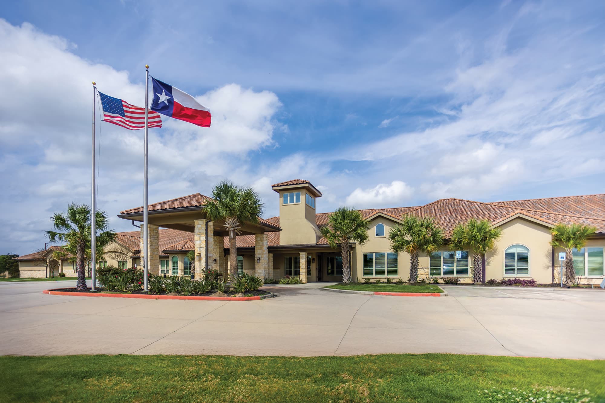 Cathedral Life Centre building entrance with U.S. and Texas flags